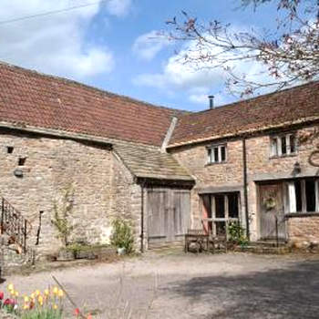 Converted stables and hayloft in former farmyard
